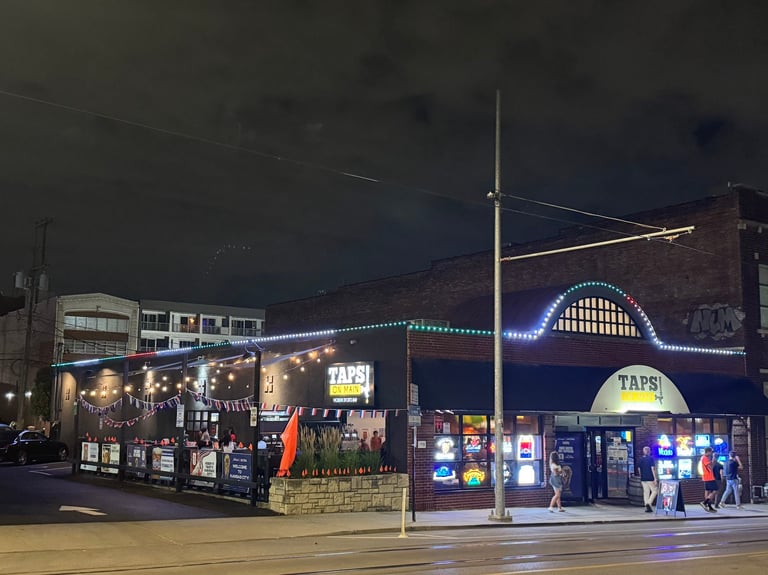 Taps On Main Kansas City commercial permanent LED lighting illuminating storefront at night