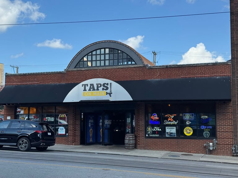 Taps On Main Kansas City commercial building with permanent LED lighting on brick facade