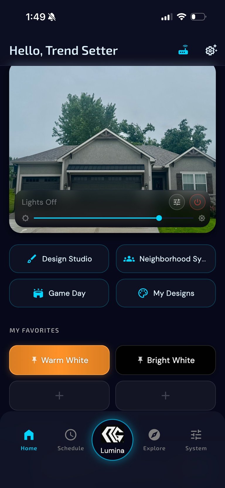 Mobile app interface for smart home lighting control showing a house exterior with lights off, quick action buttons, and favorite lighting presets
